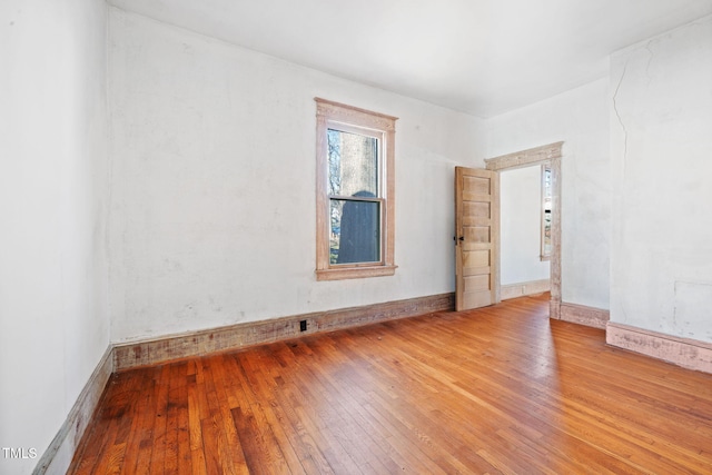 unfurnished room with light hardwood / wood-style flooring