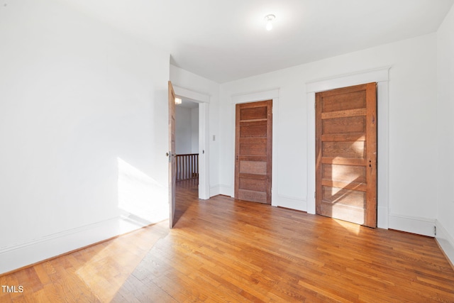 spare room with light wood-type flooring