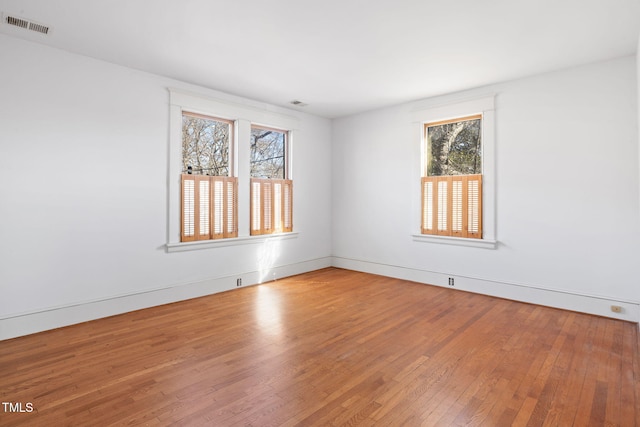 empty room featuring hardwood / wood-style floors