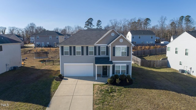 view of front of house with a front yard, cooling unit, and a garage