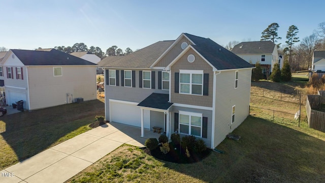 view of front of property featuring a front lawn and a garage