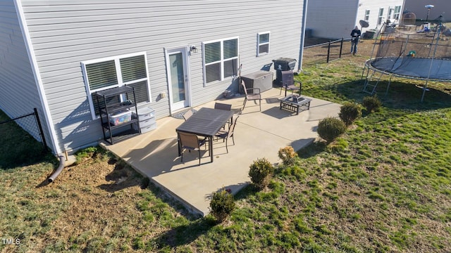 view of patio / terrace featuring grilling area and a trampoline