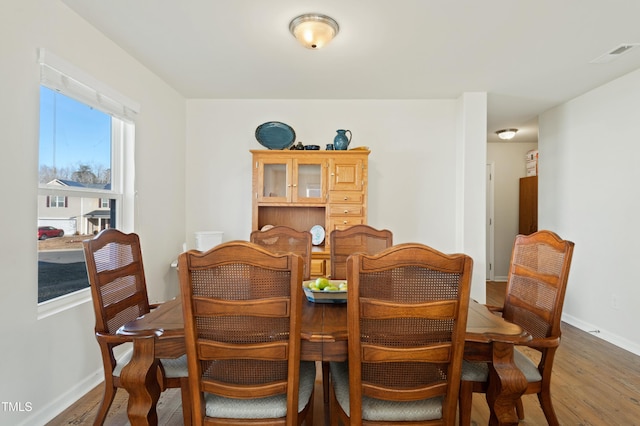 dining area featuring hardwood / wood-style floors