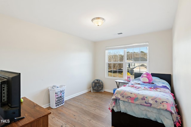 bedroom with light hardwood / wood-style floors