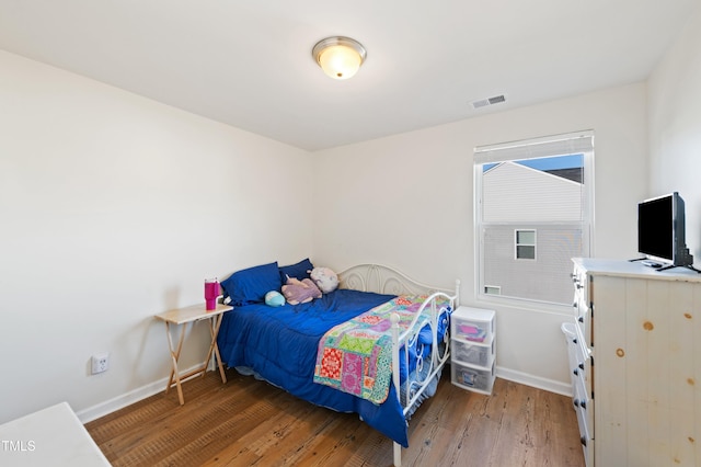 bedroom featuring hardwood / wood-style flooring