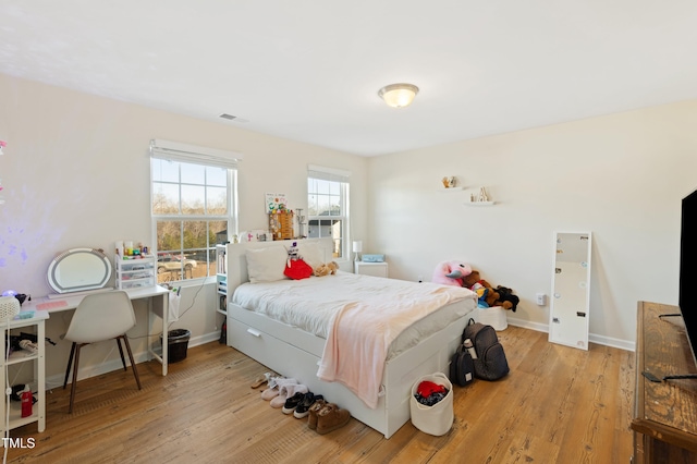 bedroom with light wood-type flooring