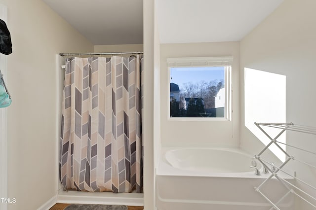 bathroom featuring a tub to relax in