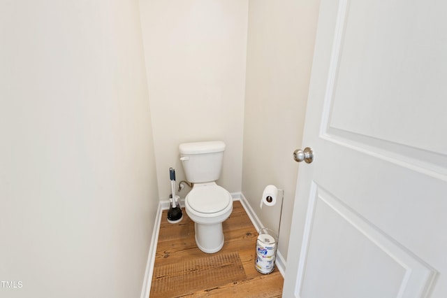 bathroom featuring toilet and hardwood / wood-style floors