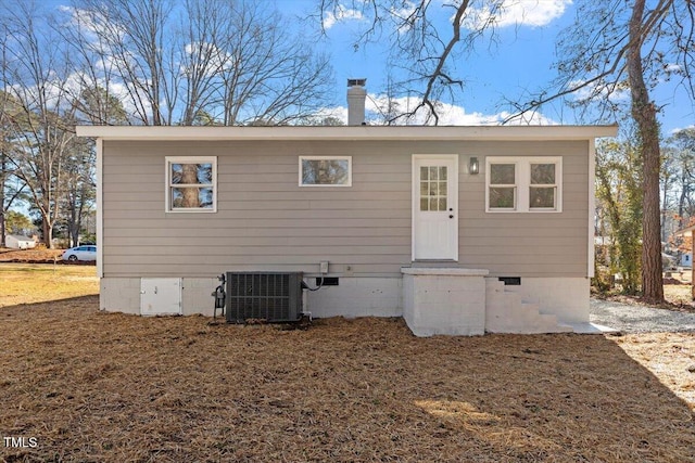 rear view of property featuring central AC unit