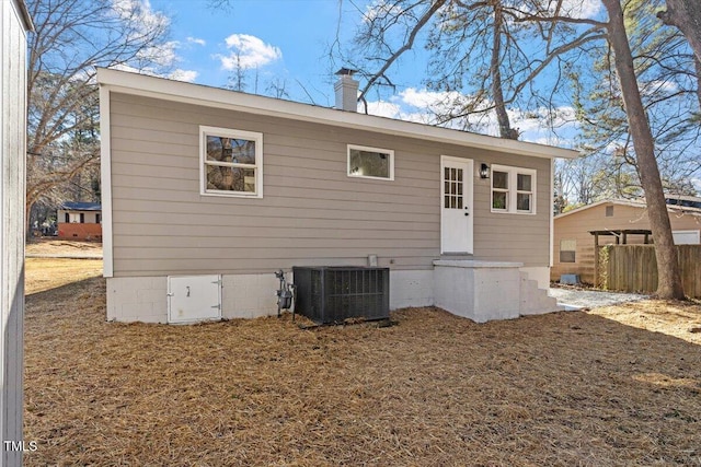 back of property featuring cooling unit