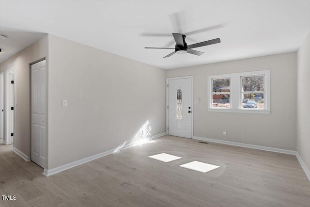 spare room featuring ceiling fan and light wood-type flooring