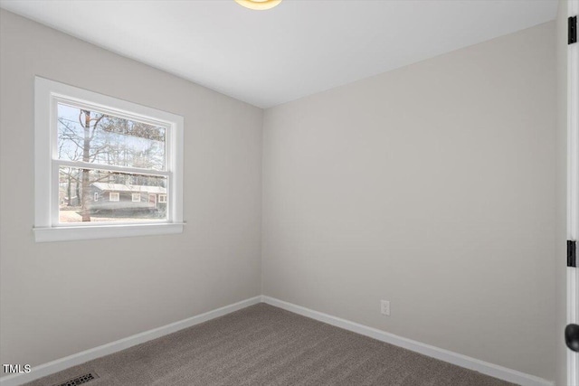 empty room featuring carpet flooring