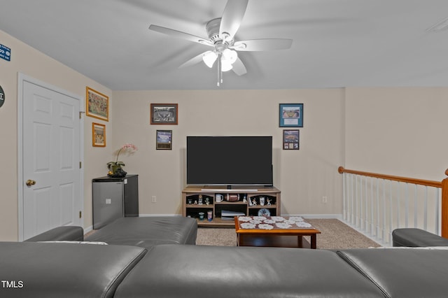 carpeted living room featuring ceiling fan