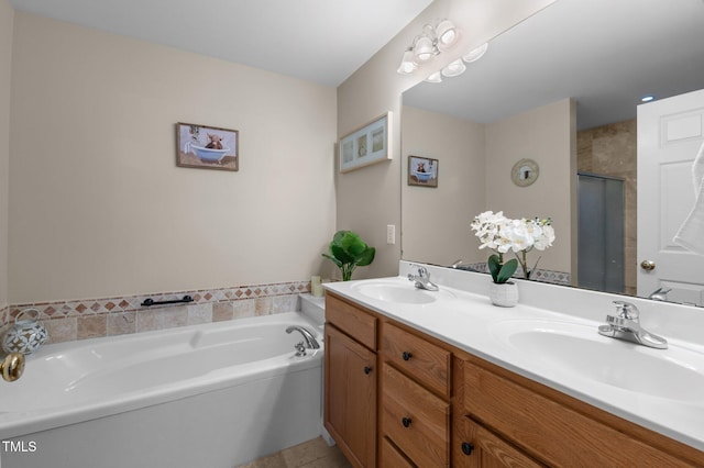 bathroom with vanity, independent shower and bath, and tile patterned flooring