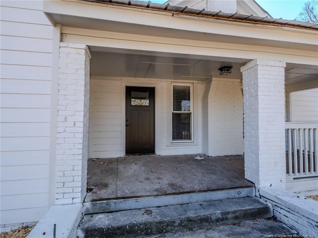 entrance to property with covered porch