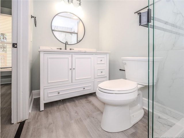 bathroom featuring a shower with door, wood-type flooring, toilet, and vanity