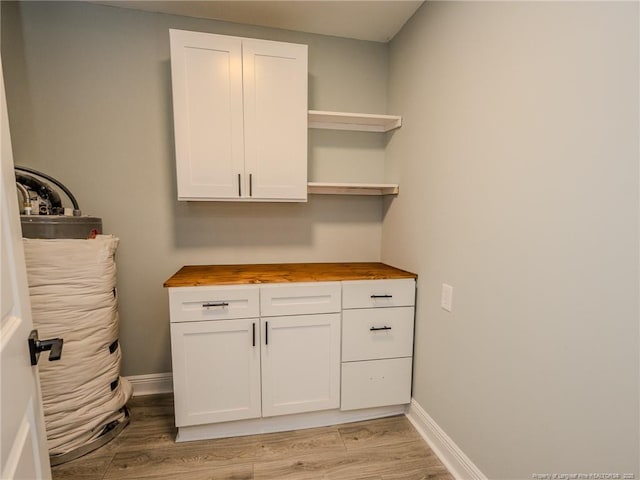 laundry room with light hardwood / wood-style flooring