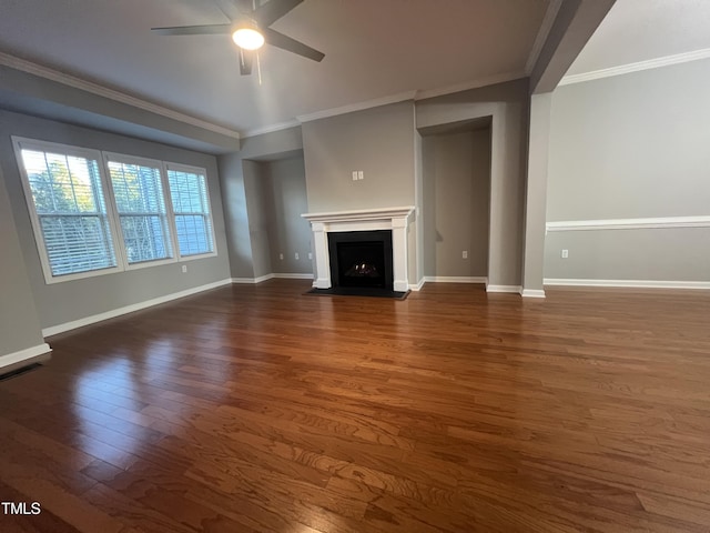 unfurnished living room with ornamental molding, dark hardwood / wood-style floors, and ceiling fan