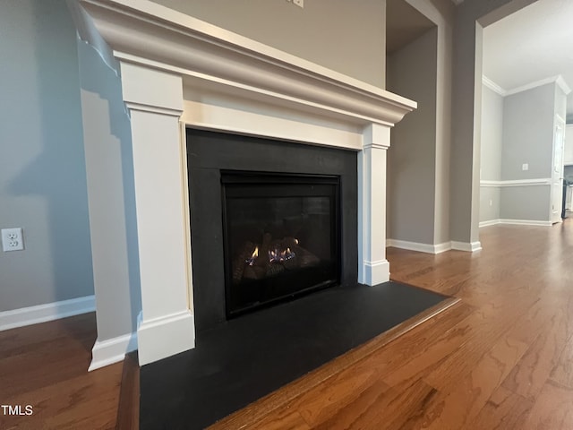 details featuring hardwood / wood-style floors and ornamental molding