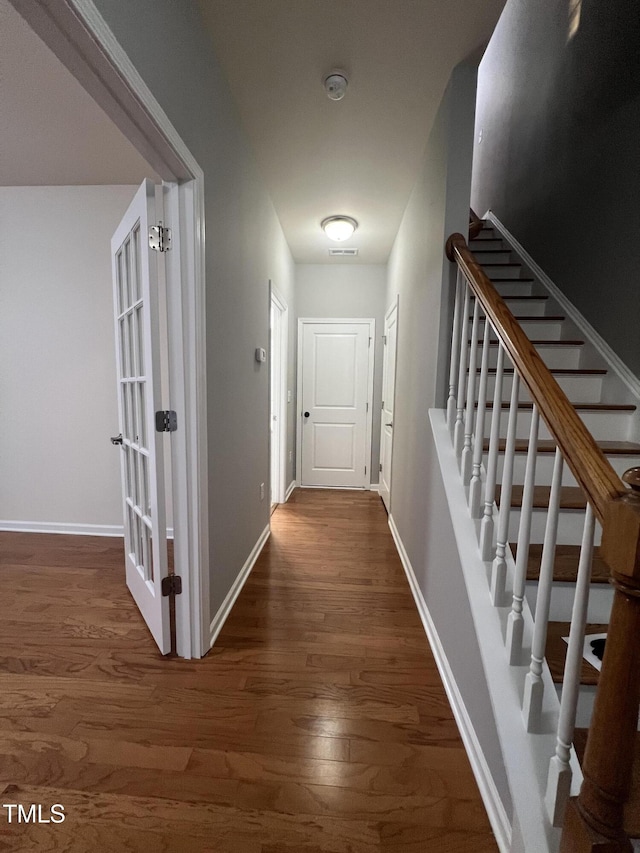 hall with dark hardwood / wood-style floors