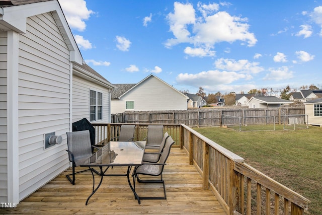 wooden deck with a yard