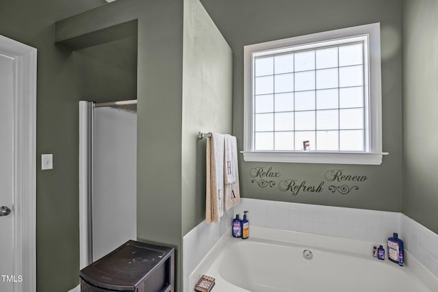 bathroom featuring a tub to relax in