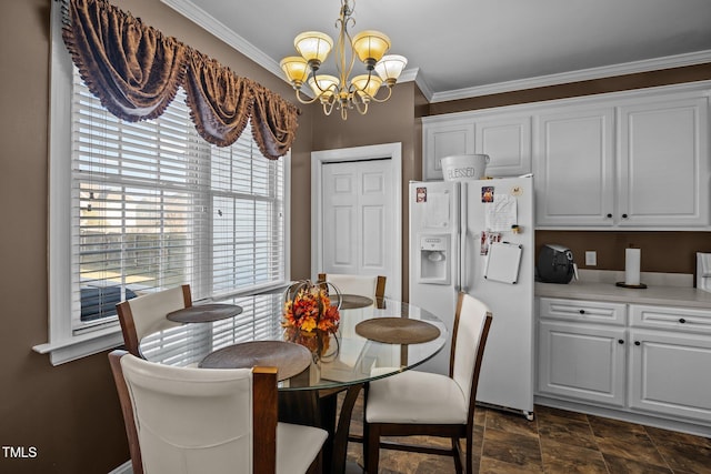 dining space featuring crown molding and a notable chandelier