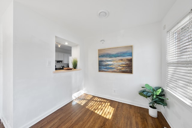 unfurnished room featuring dark hardwood / wood-style floors