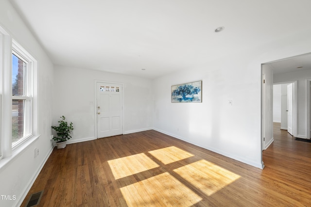 spare room featuring hardwood / wood-style floors