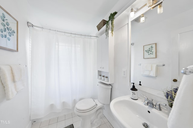 full bathroom featuring sink, toilet, shower / bath combination with curtain, and tile patterned flooring