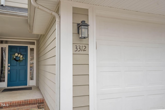 entrance to property featuring a garage