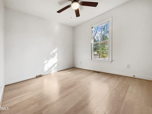 unfurnished room featuring ceiling fan and light hardwood / wood-style flooring