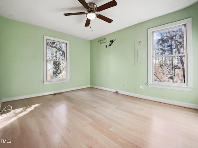 empty room with light hardwood / wood-style floors and ceiling fan