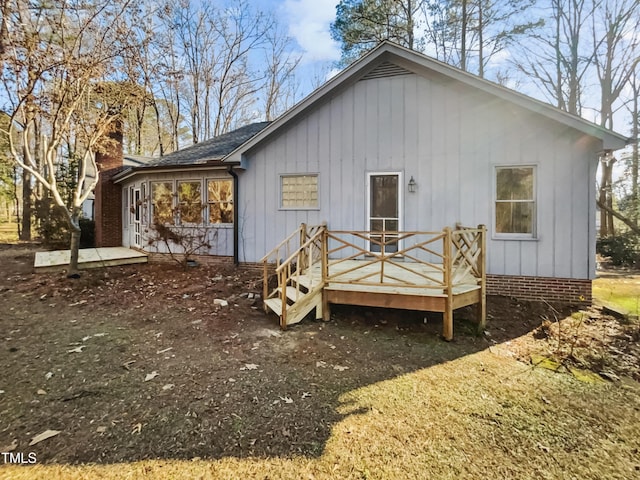 rear view of property with a deck