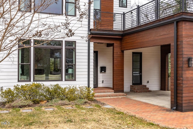 property entrance featuring a patio area