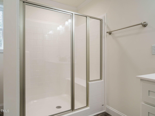 bathroom featuring a shower with shower door