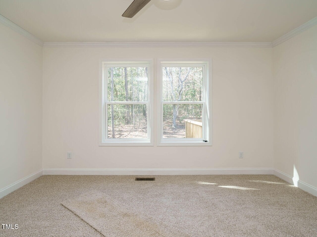 carpeted empty room with ornamental molding and ceiling fan