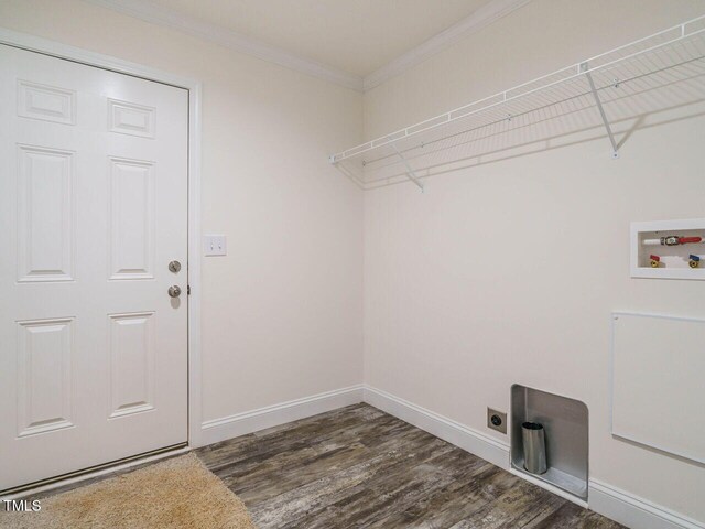 laundry area with crown molding, hookup for an electric dryer, dark hardwood / wood-style flooring, and hookup for a washing machine