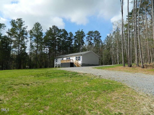 3050 Bennett Siler City Rd, Bennett, NC 27208 - view of outbuilding featuring gravel driveway and a view of trees