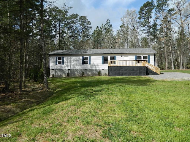 3050 Bennett Siler City Rd, Bennett, NC 27208 - manufactured / mobile home featuring crawl space, a front yard, a wooden deck, and stairway