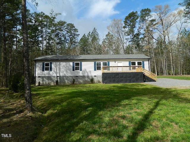 3050 Bennett Siler City Rd, Bennett, NC 27208 - manufactured / mobile home with stairway, a wooden deck, driveway, crawl space, and a front yard