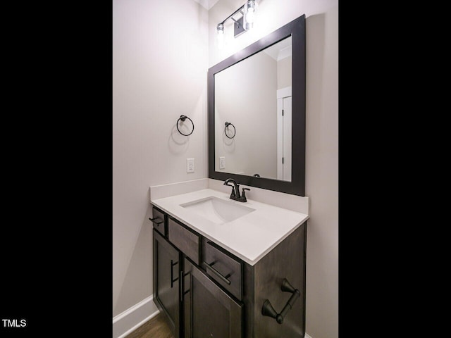 bathroom with vanity and baseboards