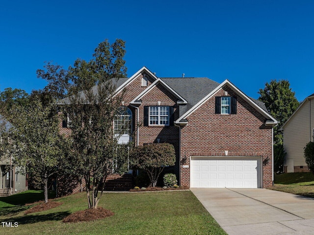 front of property featuring a garage and a front yard