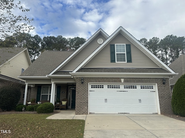 view of front of property featuring a garage and a front yard