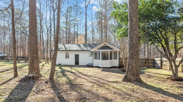 view of front of house featuring a sunroom