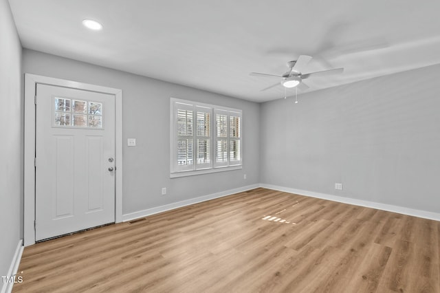 entryway featuring visible vents, a healthy amount of sunlight, baseboards, and light wood-style floors