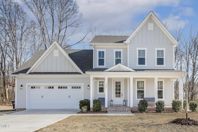 view of front of home featuring a garage and a porch