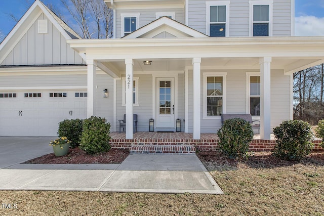 view of front of home featuring a garage and a porch