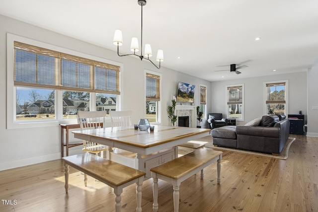 dining room featuring a chandelier and light wood-type flooring