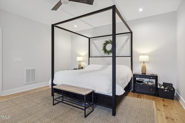 bedroom with hardwood / wood-style flooring and ceiling fan